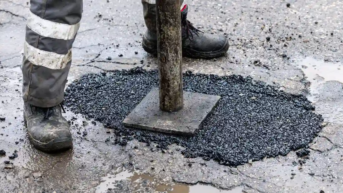 Expert asphalt pothole repair service by LineLava in Kansas, ensuring smooth and durable road surfaces.