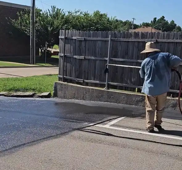 Crumbling concrete in the early stages of forming a pothole
