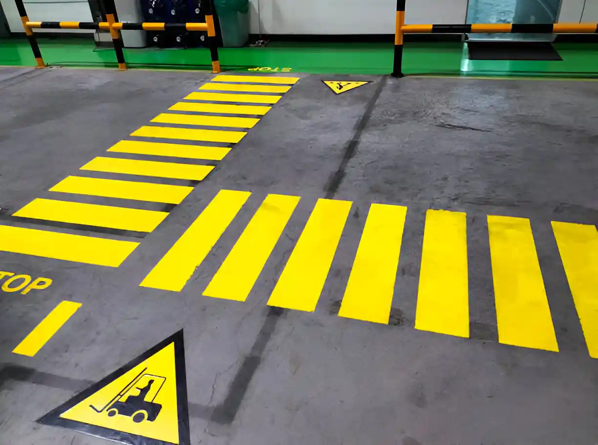 2 lanes painted on the group directing warehouse foot traffic.
